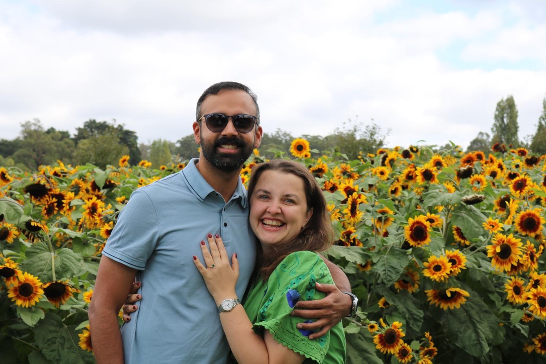 Tetiana and Uzair in a sunflower field