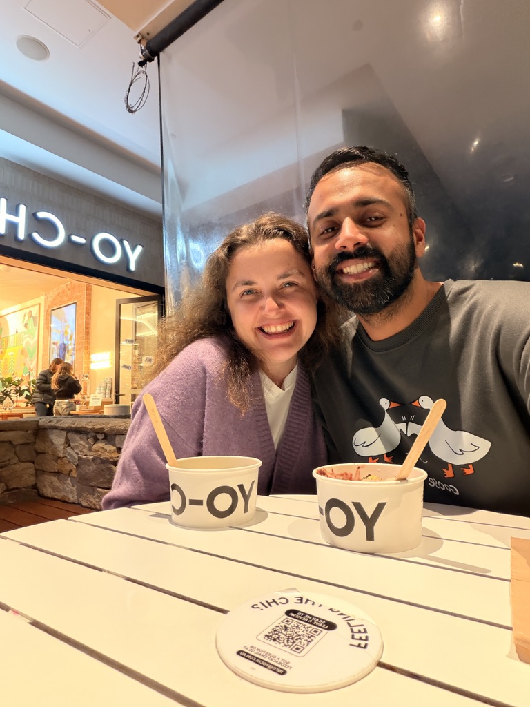 Tetiana and Uzair sharing froyo at Yo-Chi